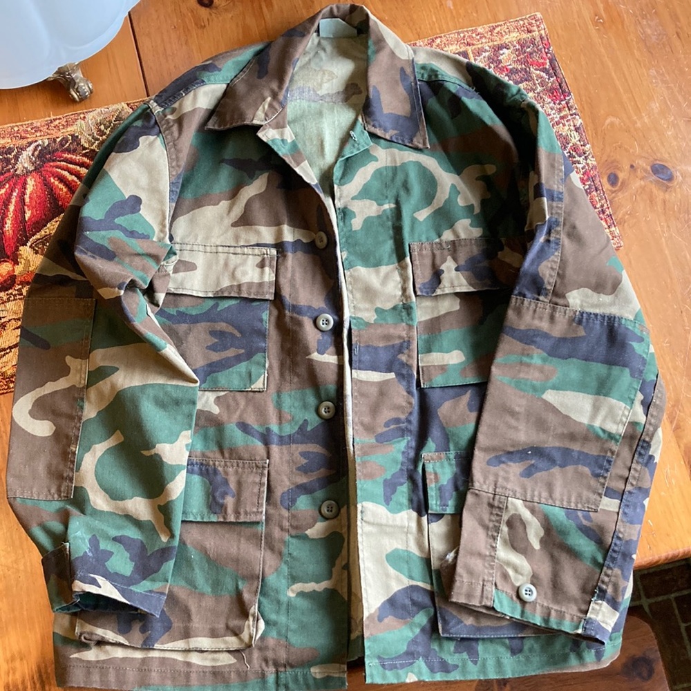 Military button up camouflage jacket.
